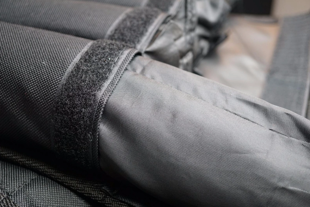 RUNmax vest weight pocket with a removable weight being inserted